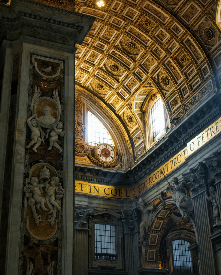 The arched and carved interior roof of a basilica.