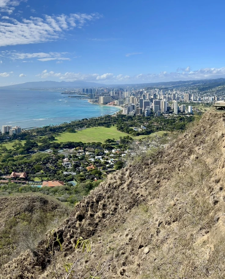 Aerial view of Island with ocean and buildings.