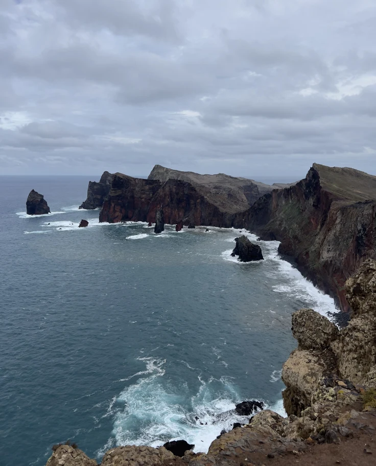 An aerial view of the sea near the cliff.