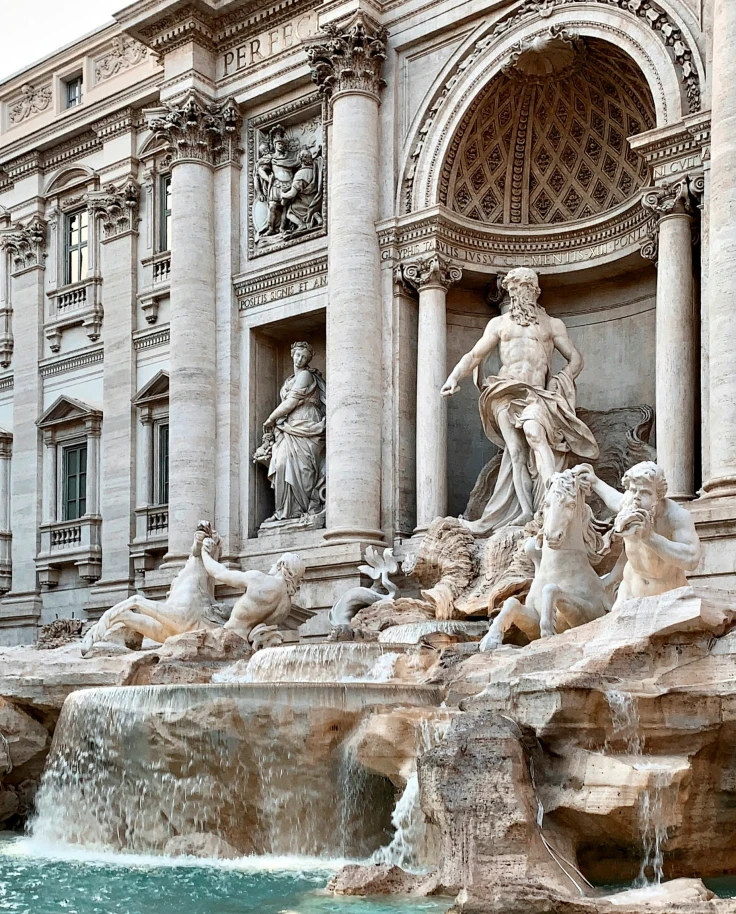 Grey concrete statue fountain during the daytime