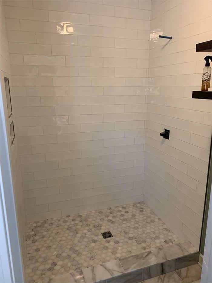 Beautiful bathroom tile by Sandoval Flooring LLC in Moundville, AL