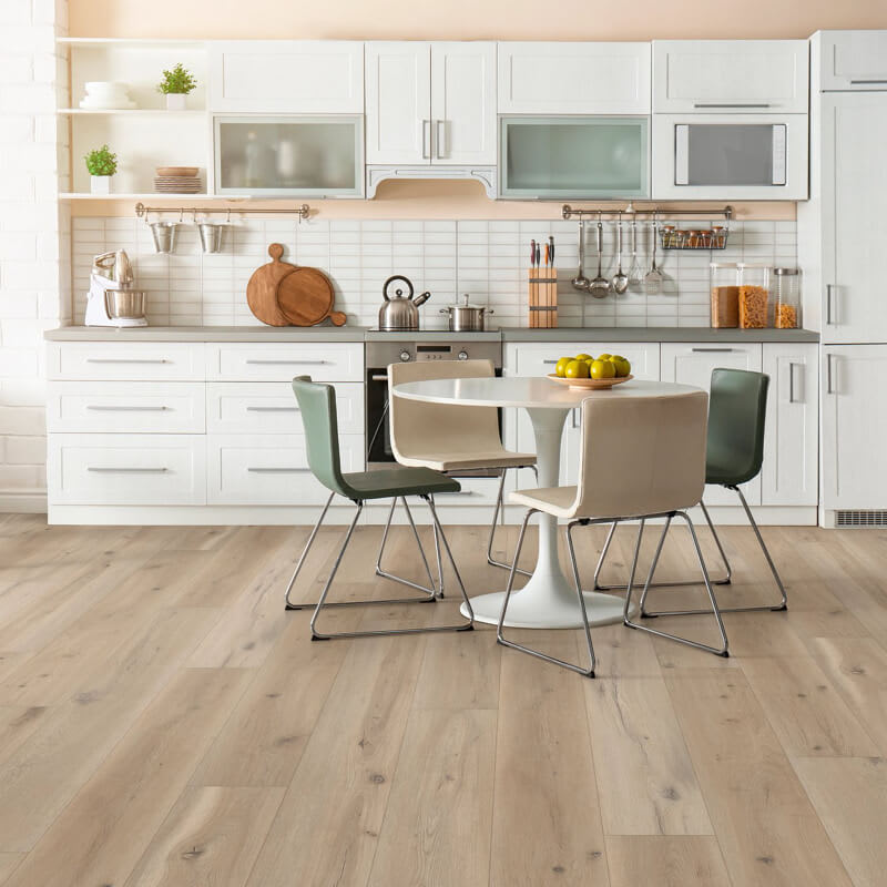 light hardwood flooring in kitchen with white cabinets