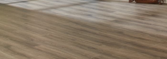Can laminate flooring withstand wet conditions?