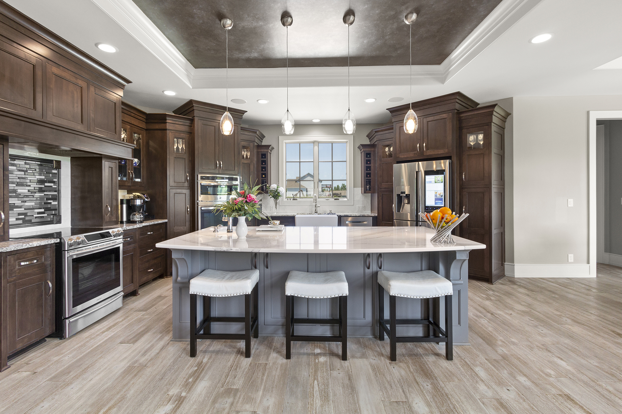 Laminate Flooring in a large kitchen with an island by A&S Carpet Collection in Allison Park, PA
