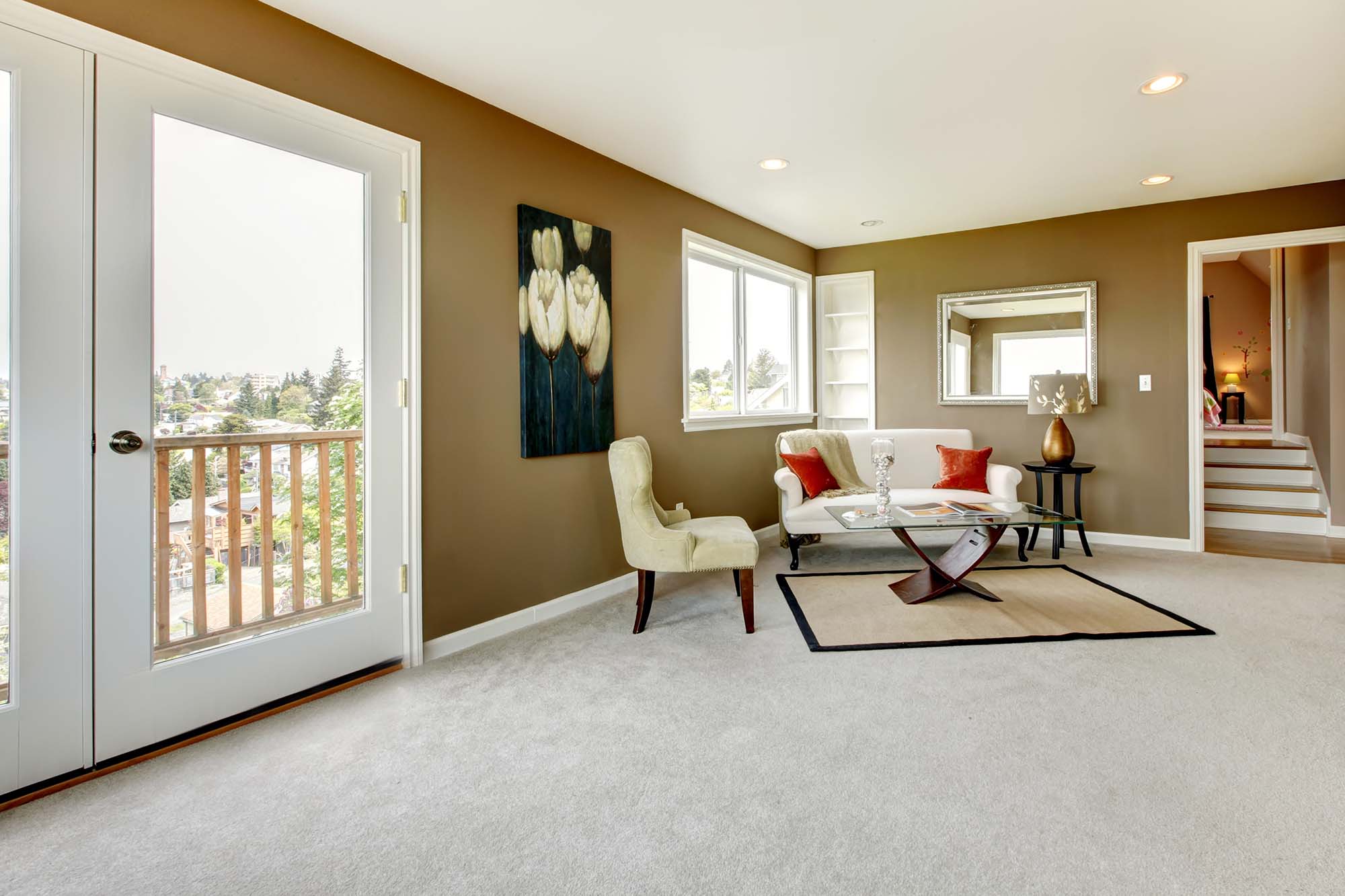 Carpet in a living room with a couch and chair by Select Floors in Marietta, GA. 