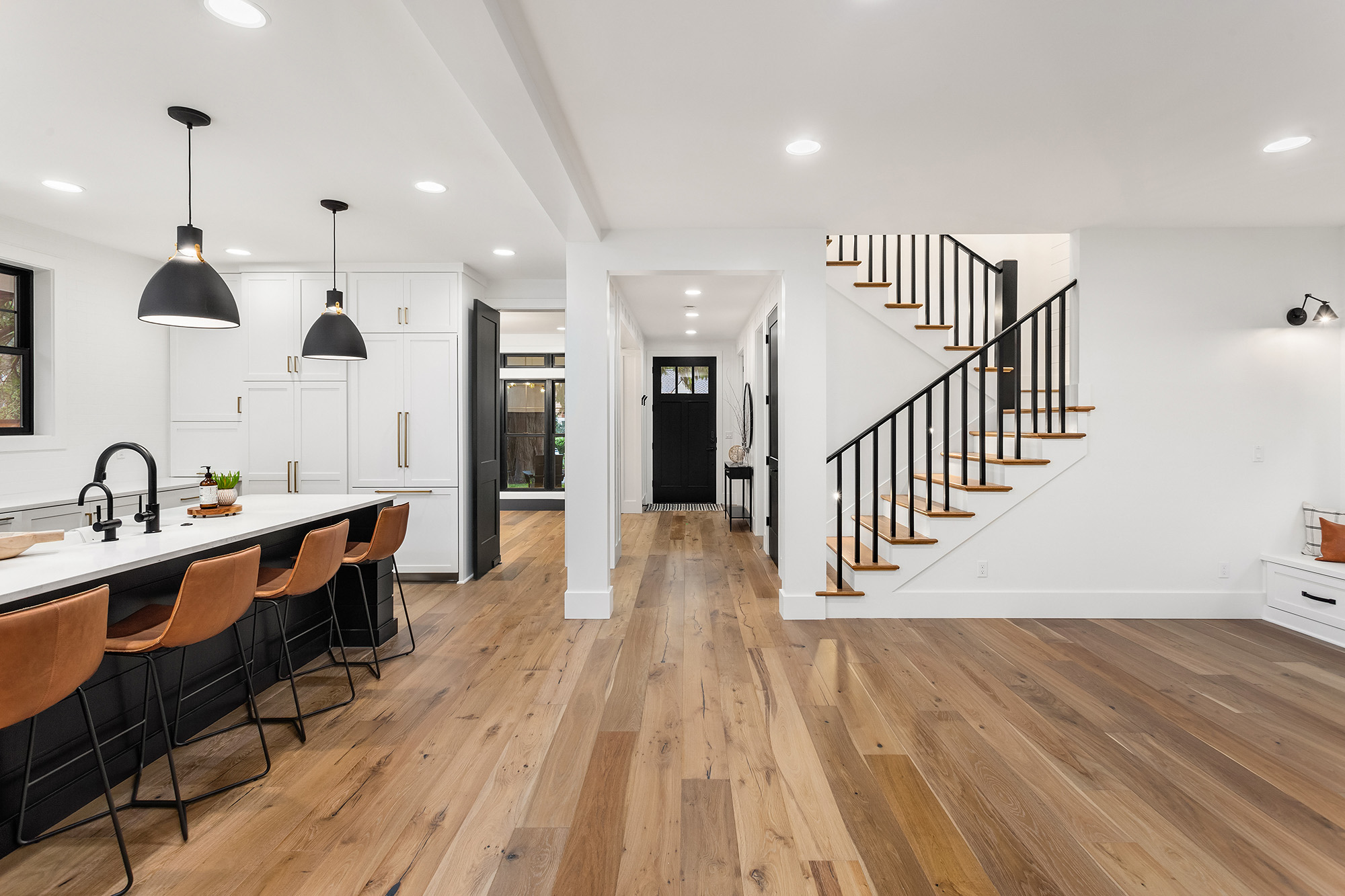 Kitchen and living room interior in new luxury home with hardwood floors by Markville in Toronto and Markham Ontario.