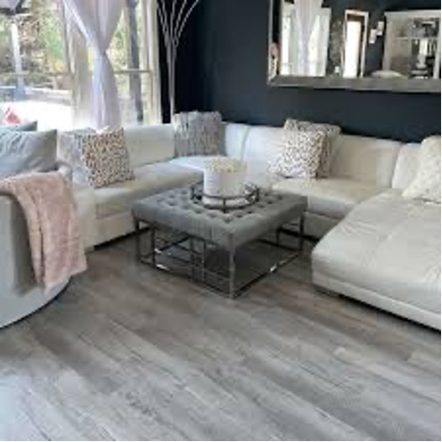 A room with a couch and a mirror