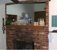 A mirror above a fireplace
