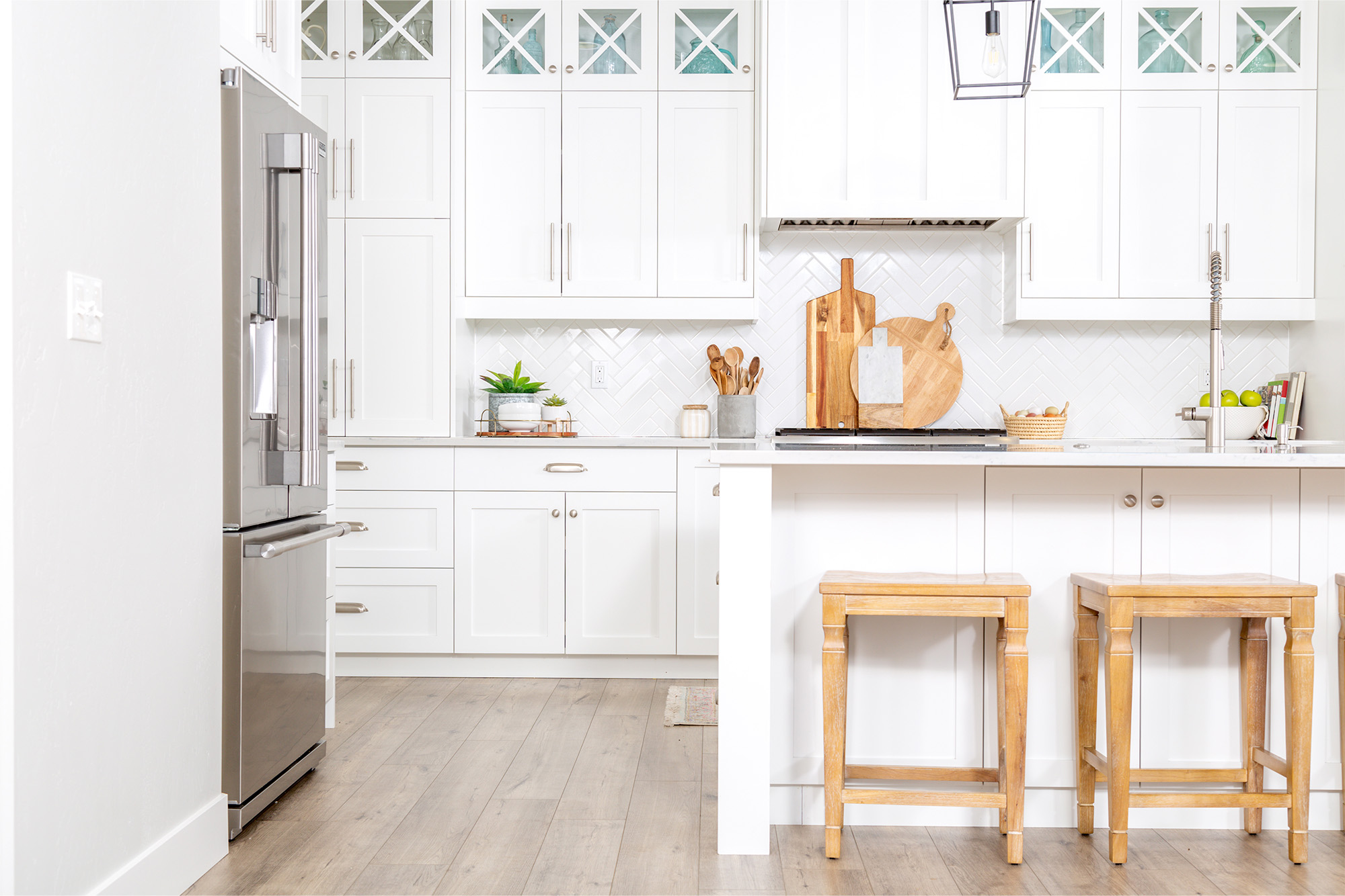 Laminate flooring in a spacious open style kitchen with a huge island by Select Floors in Marietta, GA.