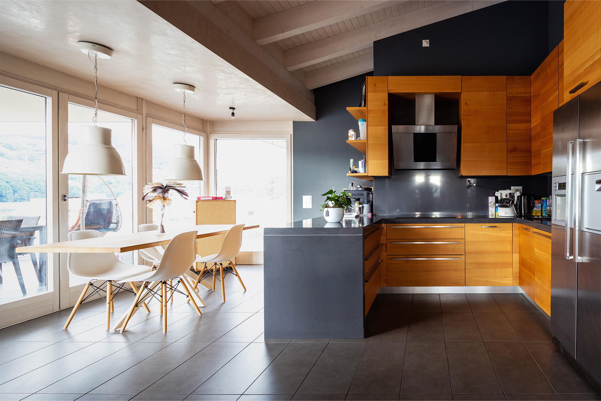 Modern kitchen with dark grey ceramic tile flooring from FloorCo Premium Flooring, available in Temple, Waco, and Killeen, Texas.