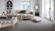 A couch in a roomDescription automatically generated