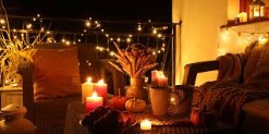 A table with candles and flowersDescription automatically generated