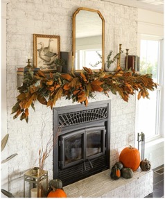 A fireplace with a mirror above itDescription automatically generated