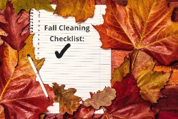 A notepad with a checklist and a pen surrounded by leavesDescription automatically generated