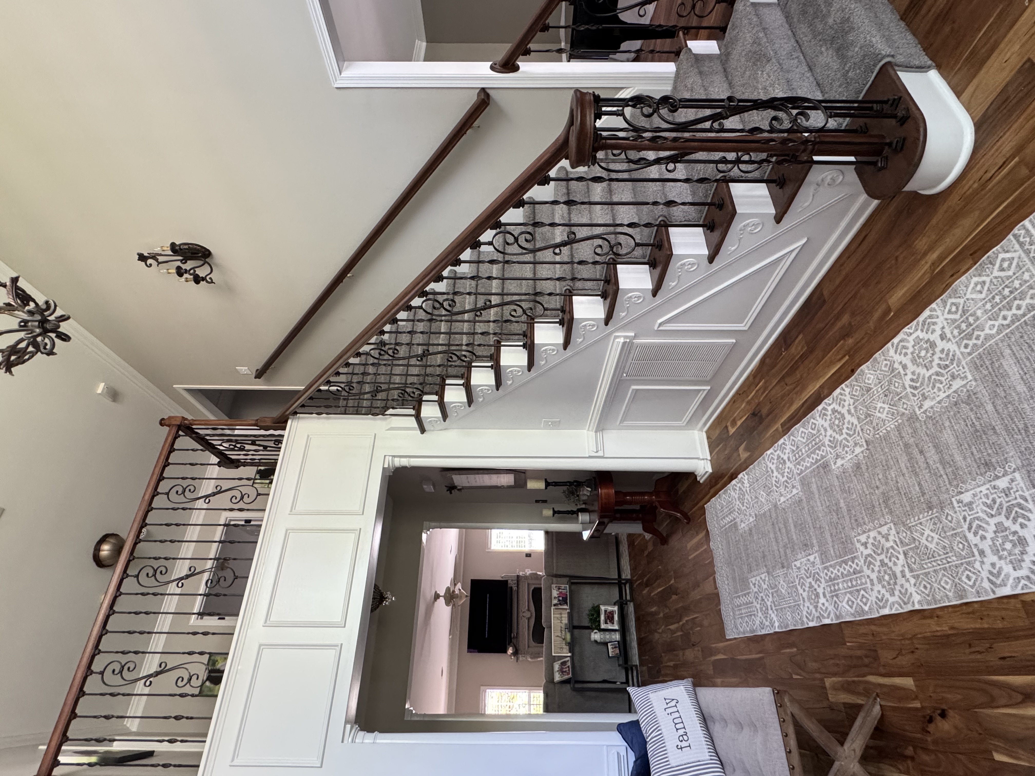 Gray Stair runner rugs leading to the second floor in a home by AJ Rose in Needham, MA - Lynnfield, MA - Natick, MA - Burlington, MA.