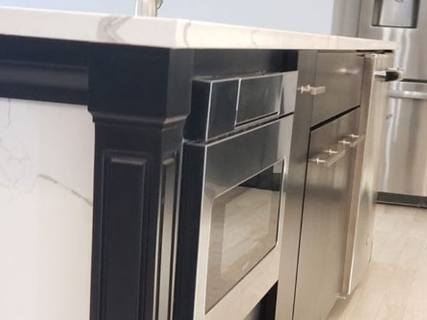 Modern Black And Quartz Kitchen in Lincoln, ME