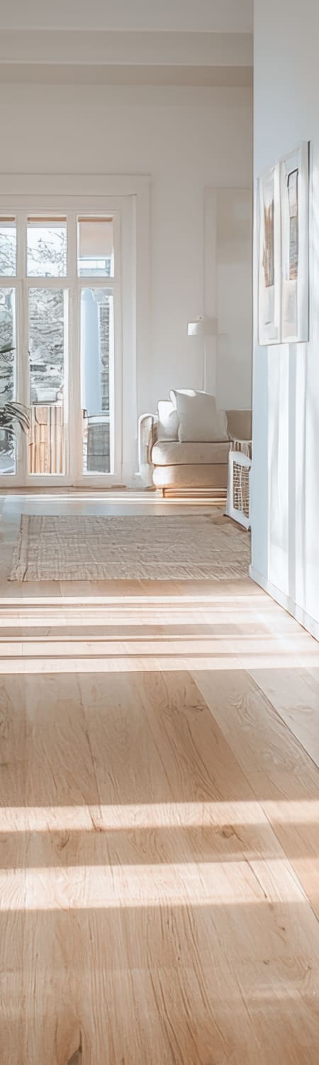 Light wood-look flooring in a remodeled Surprise, AZ living room