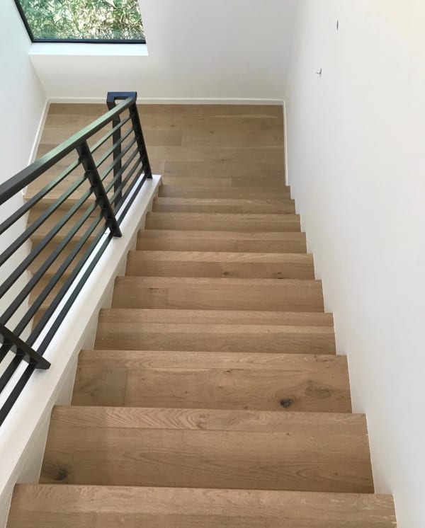 Hardwood floor stairs by Texas Flooring Professionals in Kyle, TX