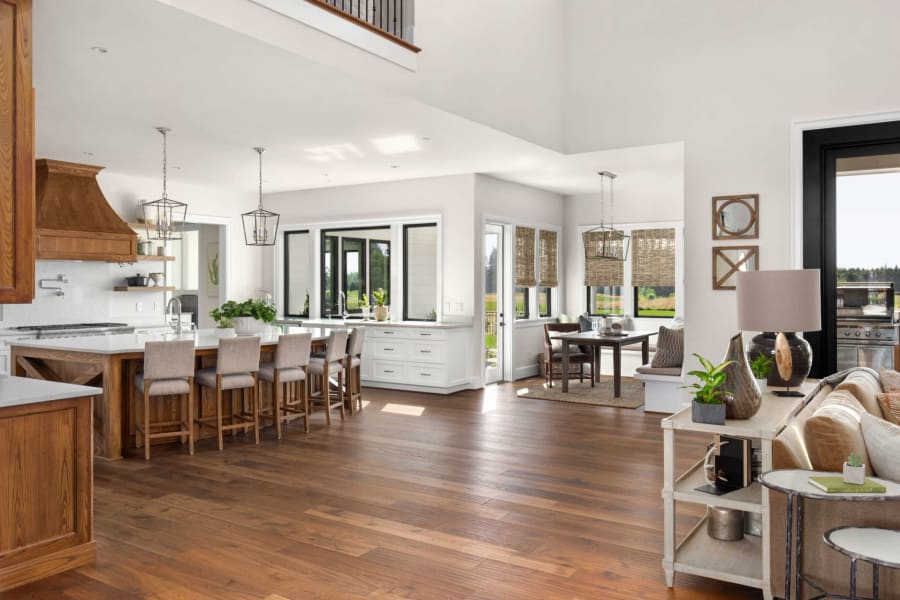 Finished hardwood flooring in a modern kitchen and living area.