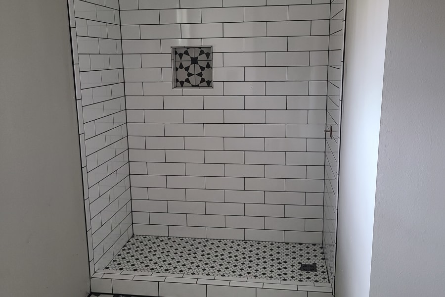 Beautiful shower tile work from Cozy Comfort Floors in Gulfport, MS