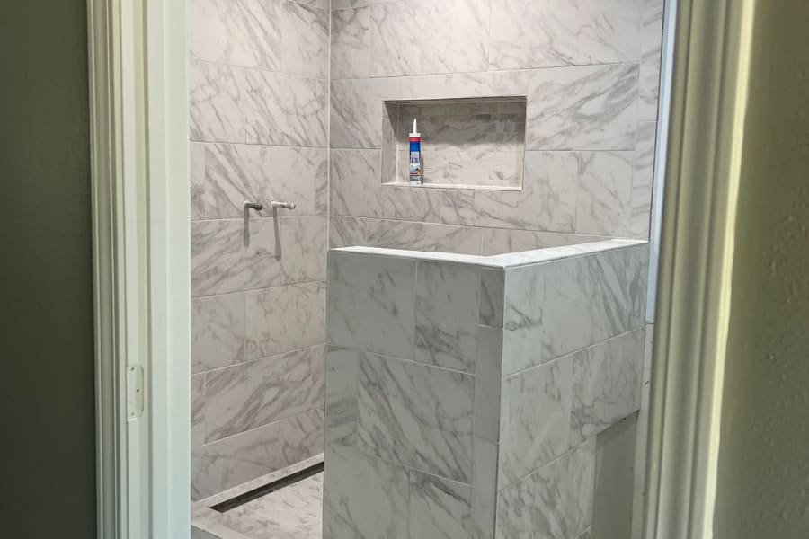 Beautiful marble bathroom tile work from Cozy Comfort Floors in Gulfport, MS