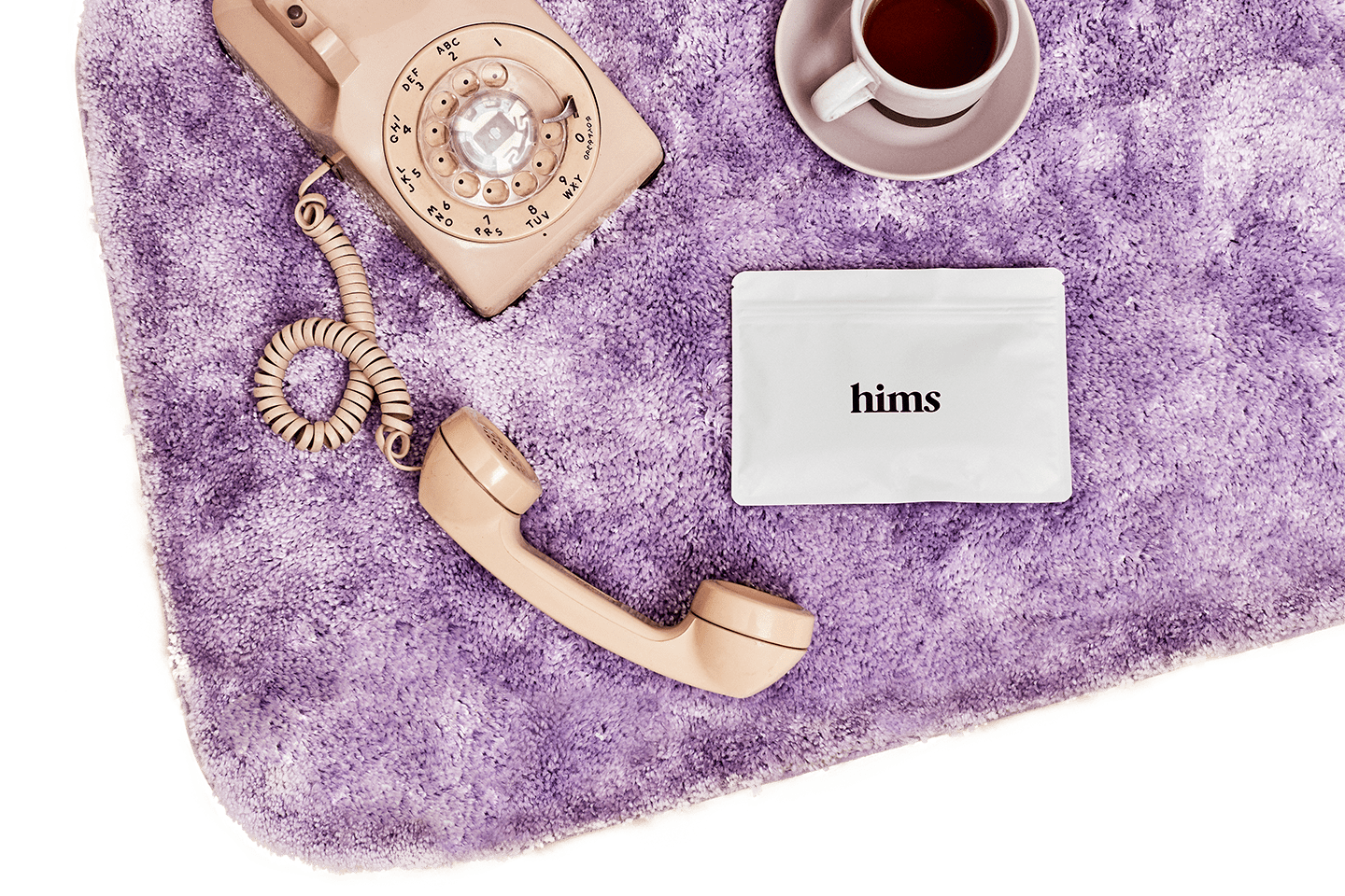 phone on purple bath mat