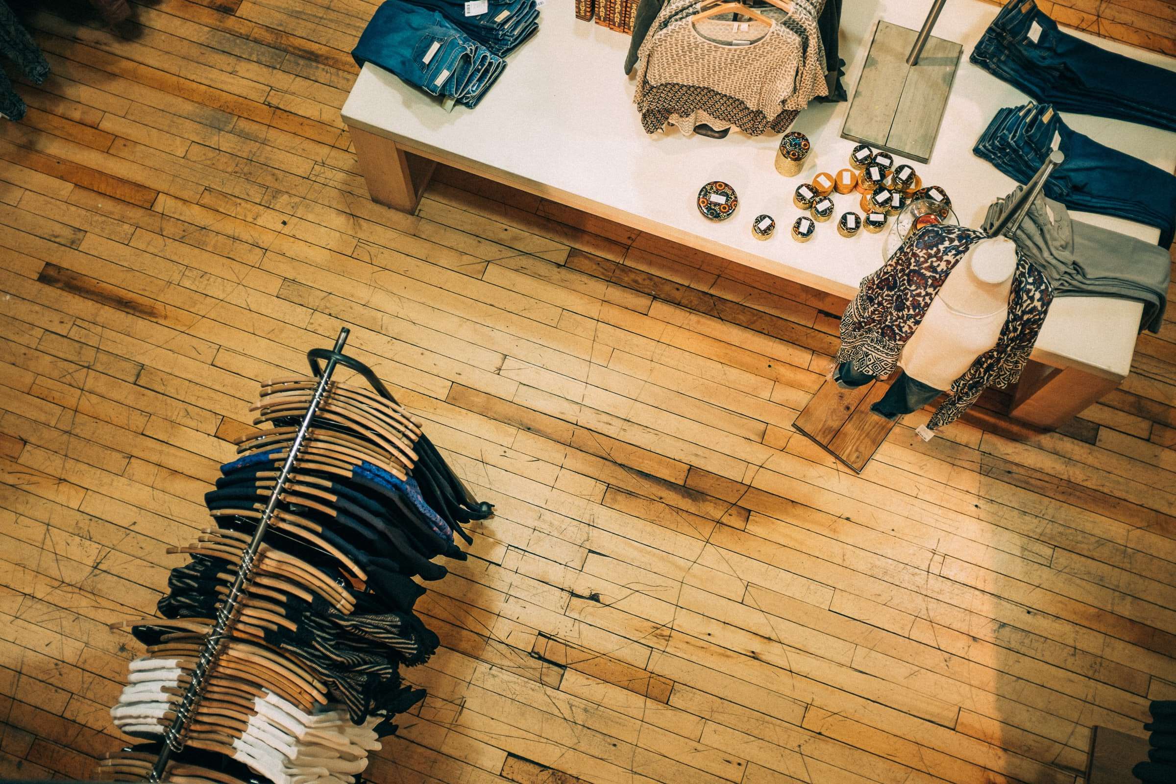 Photo by Ashim D’Silva on Unsplash of a clothing store shot from above