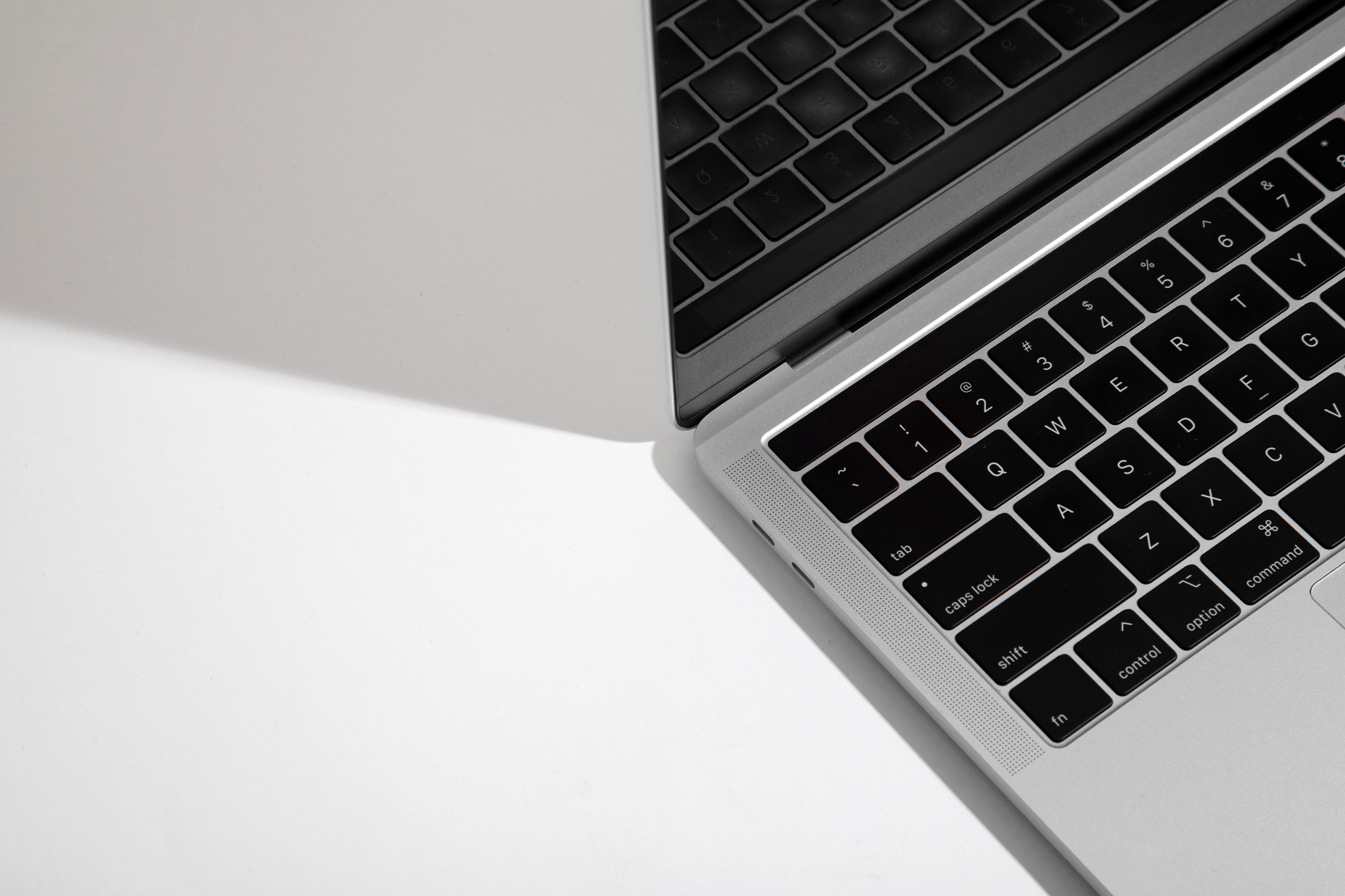 Image of an Apple laptop sitting on a desk