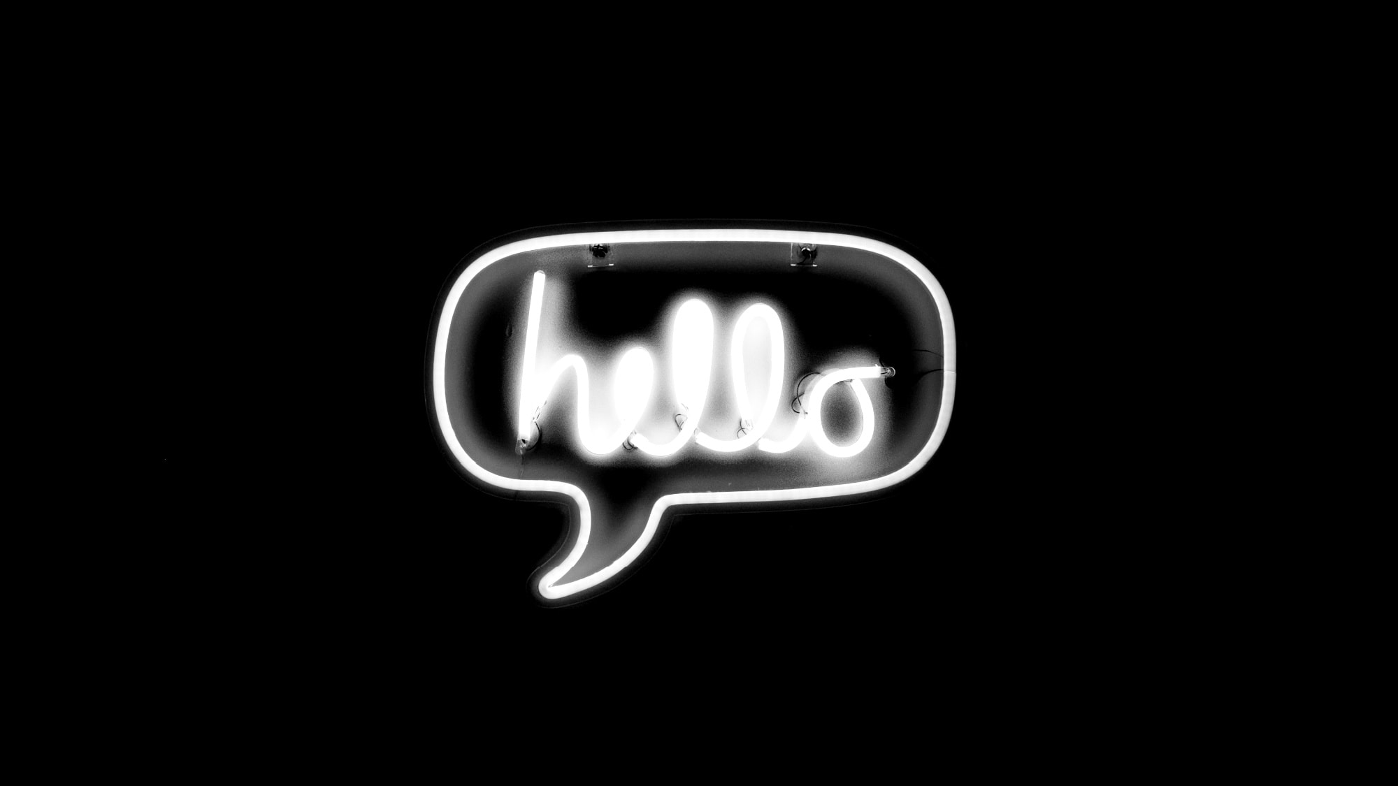 Image original file by Drew Beamer of a neon sign that says "hello" (Unsplash)