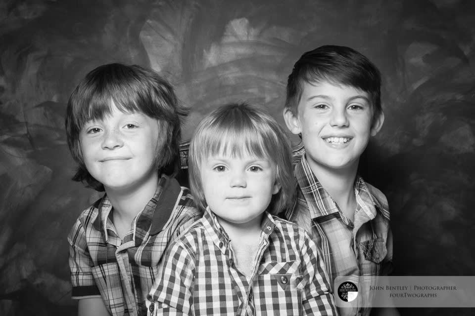 Three boys and a box of raisins