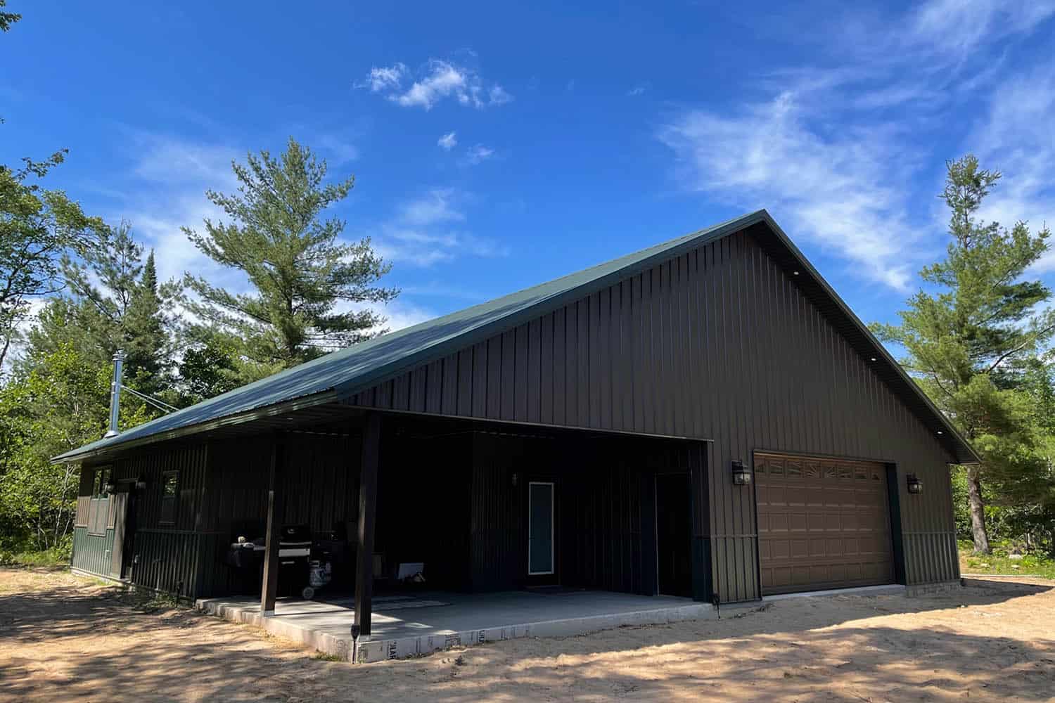 A mostly black colored shouse with covered front porch