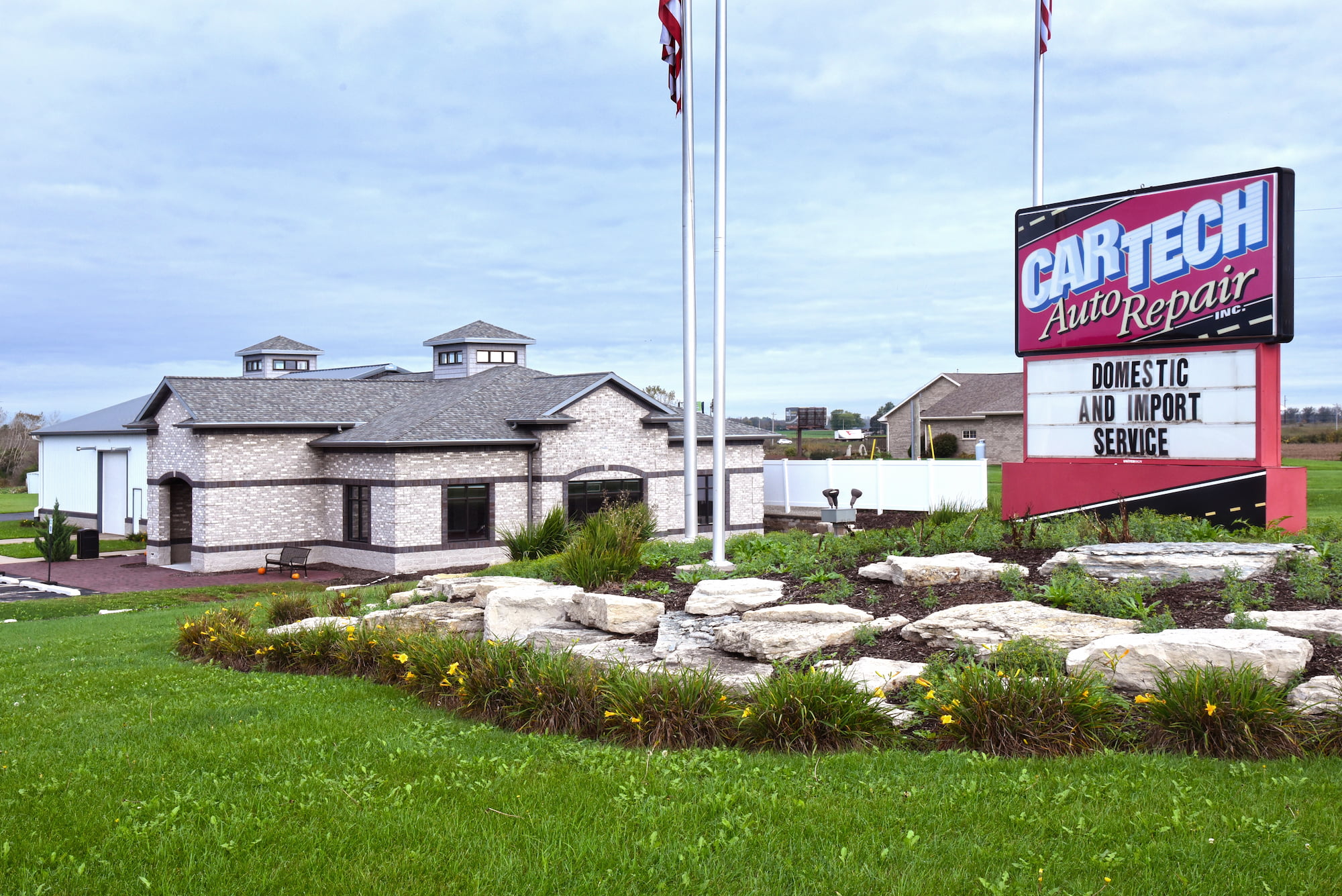 CarTech Auto Repair signage and landscaping with CarTech building in the background