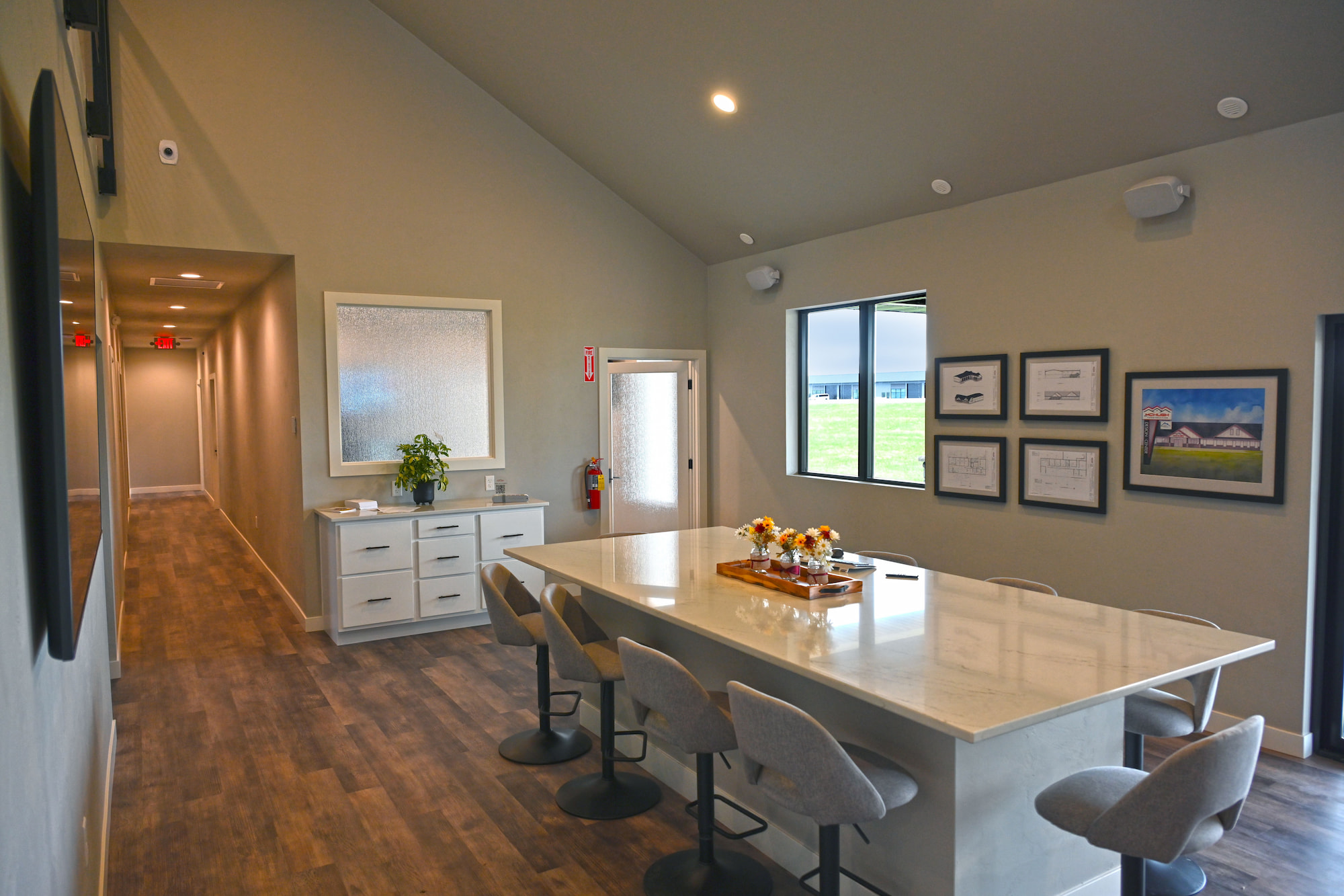 Open-concept commercial construction interior meeting area with bar seating