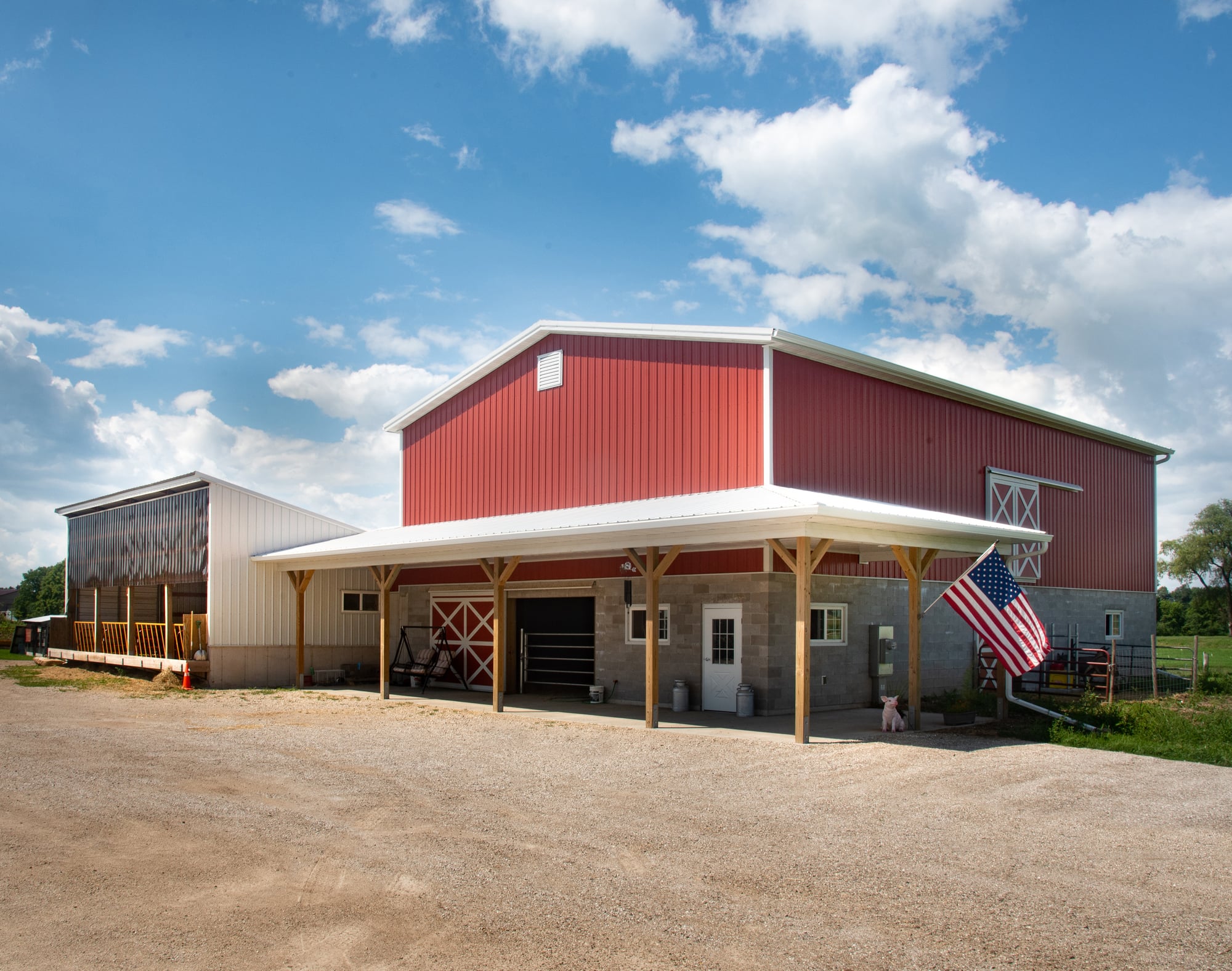 Front exterior of a brand new red and white barn at Kessler family farm