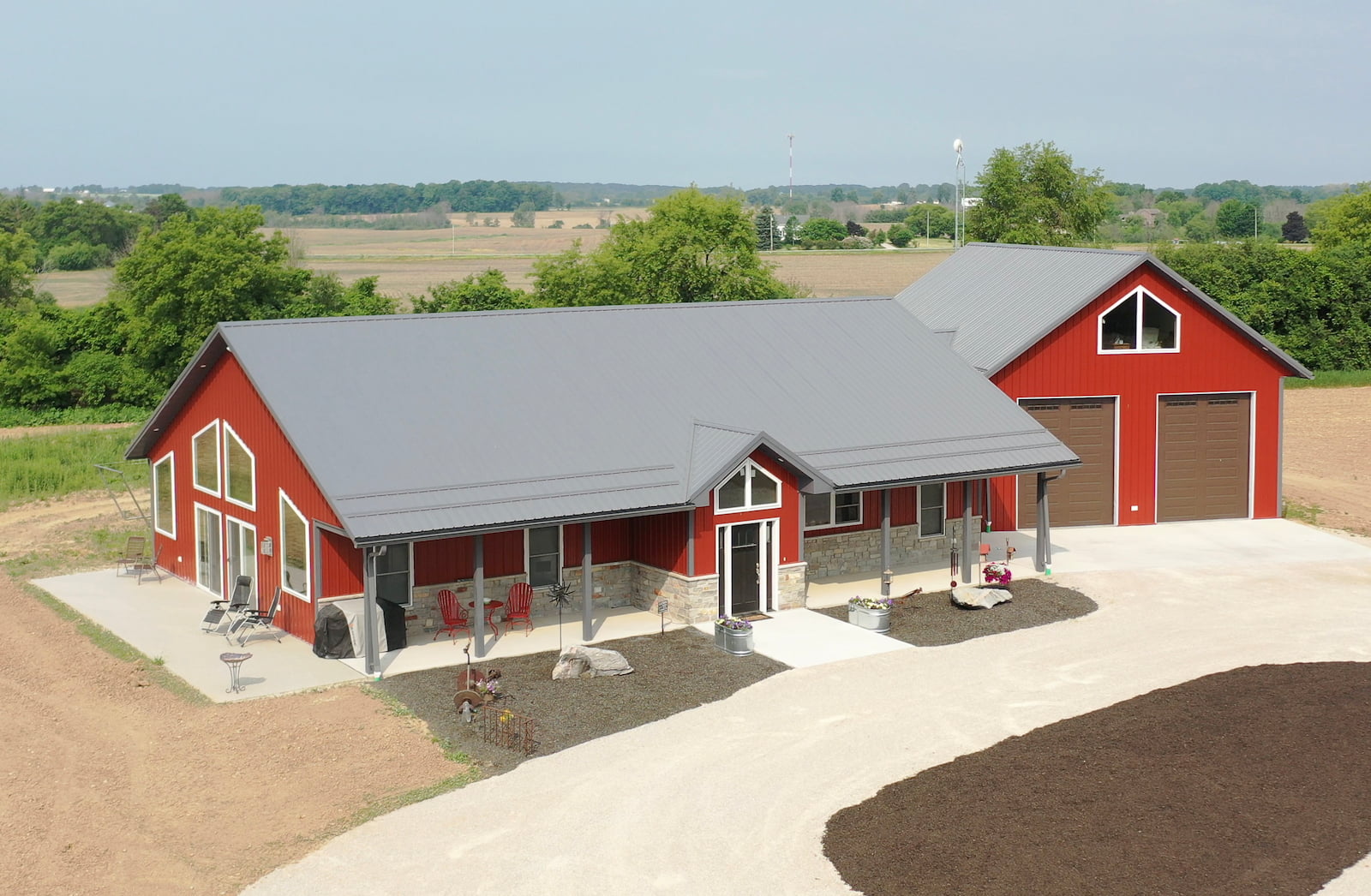 A large bright red shouse with grey metal roof