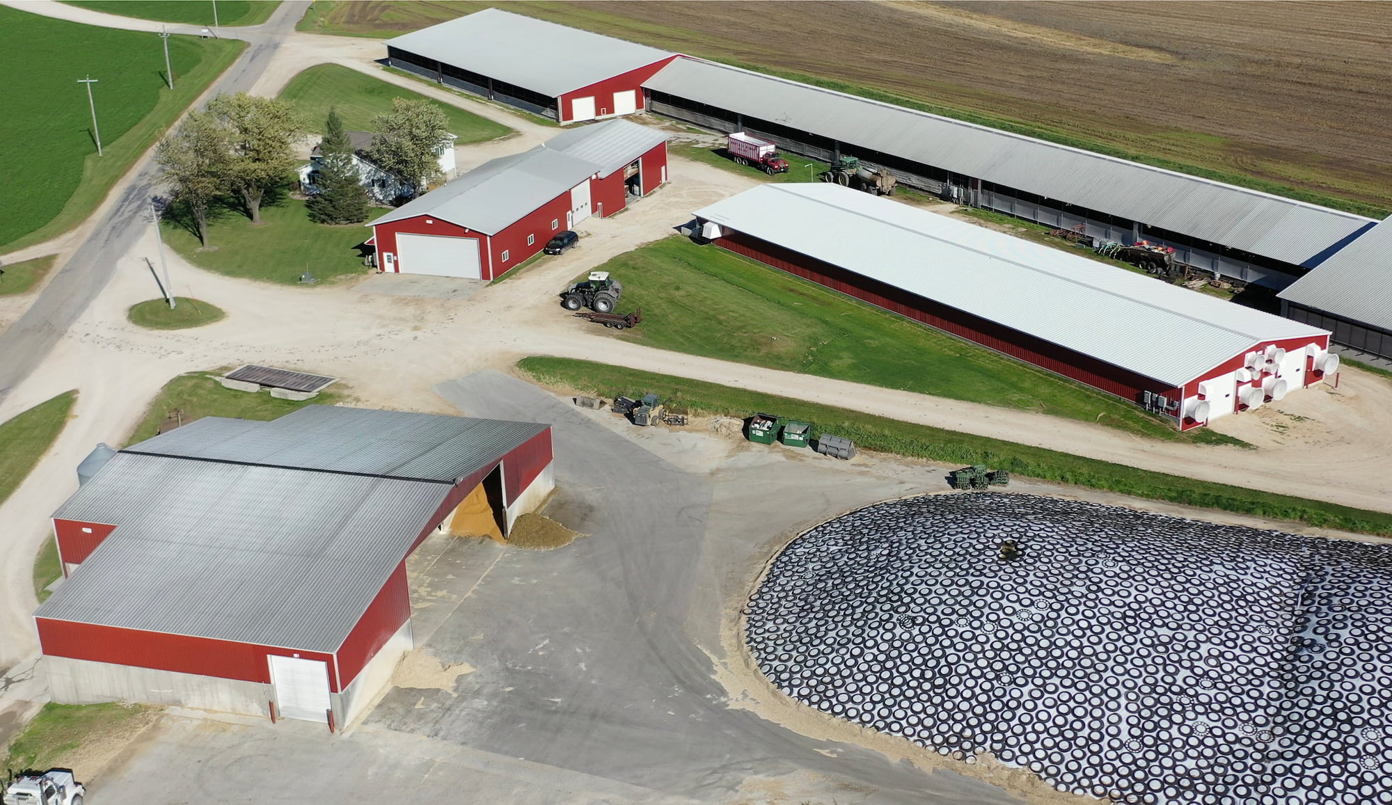 Drone view of Retail Ridge Dairy and their four large storage buildings and cattle barns