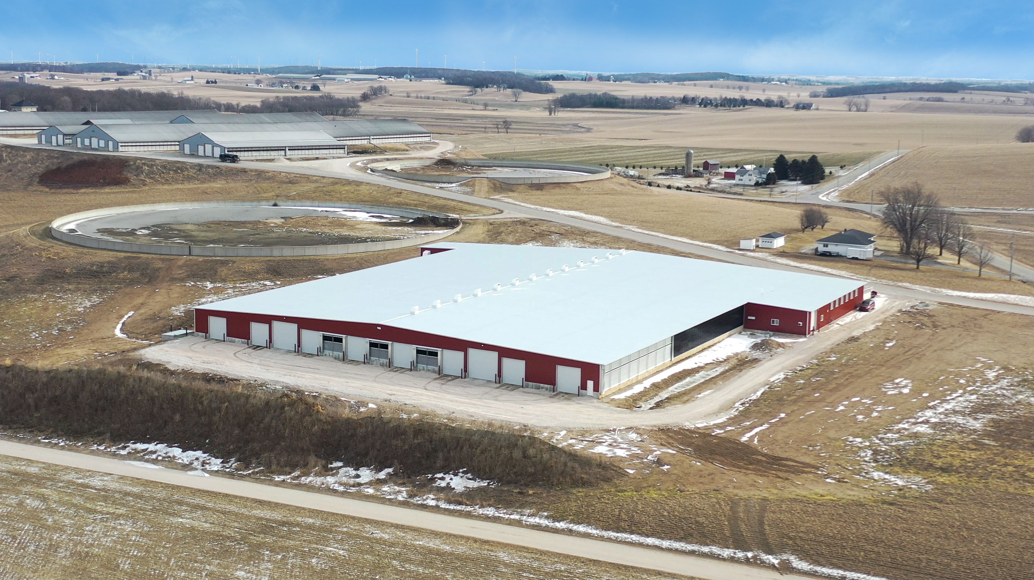 Redtail Ridge Dairy expansion with freestall barn, vac/electrical room, milking parlor, heifer barn, and shop with wash bay