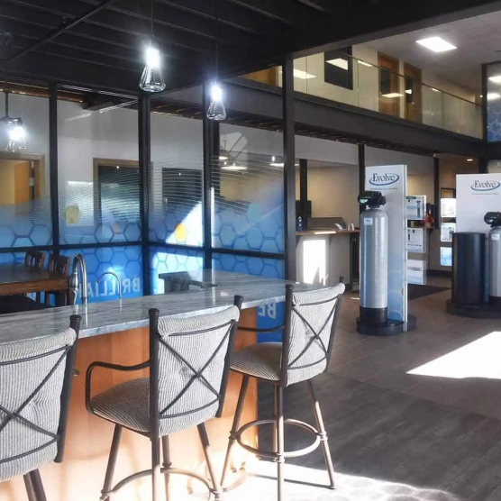 Marble counter with stools in the showroom area at Water Right's Clean Water Center