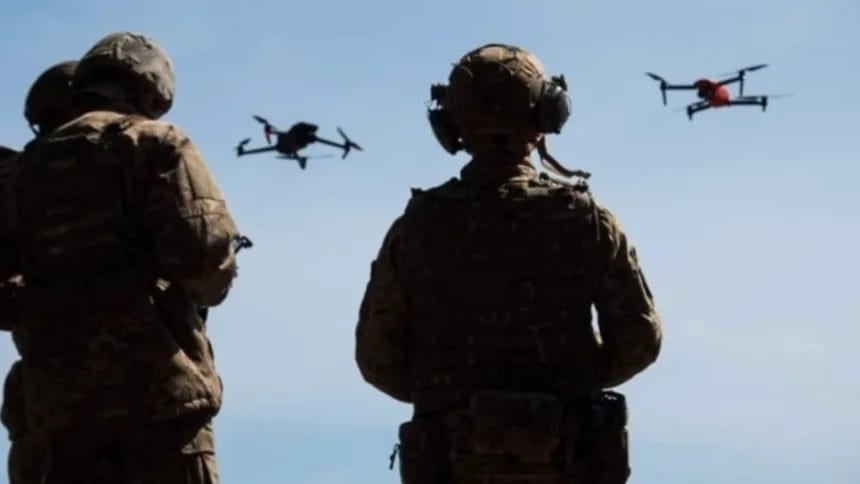 Engineers and robots assembling drones in a joint EU-Ukraine production facility