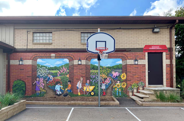 School mural photo before editing, with equipment in the way