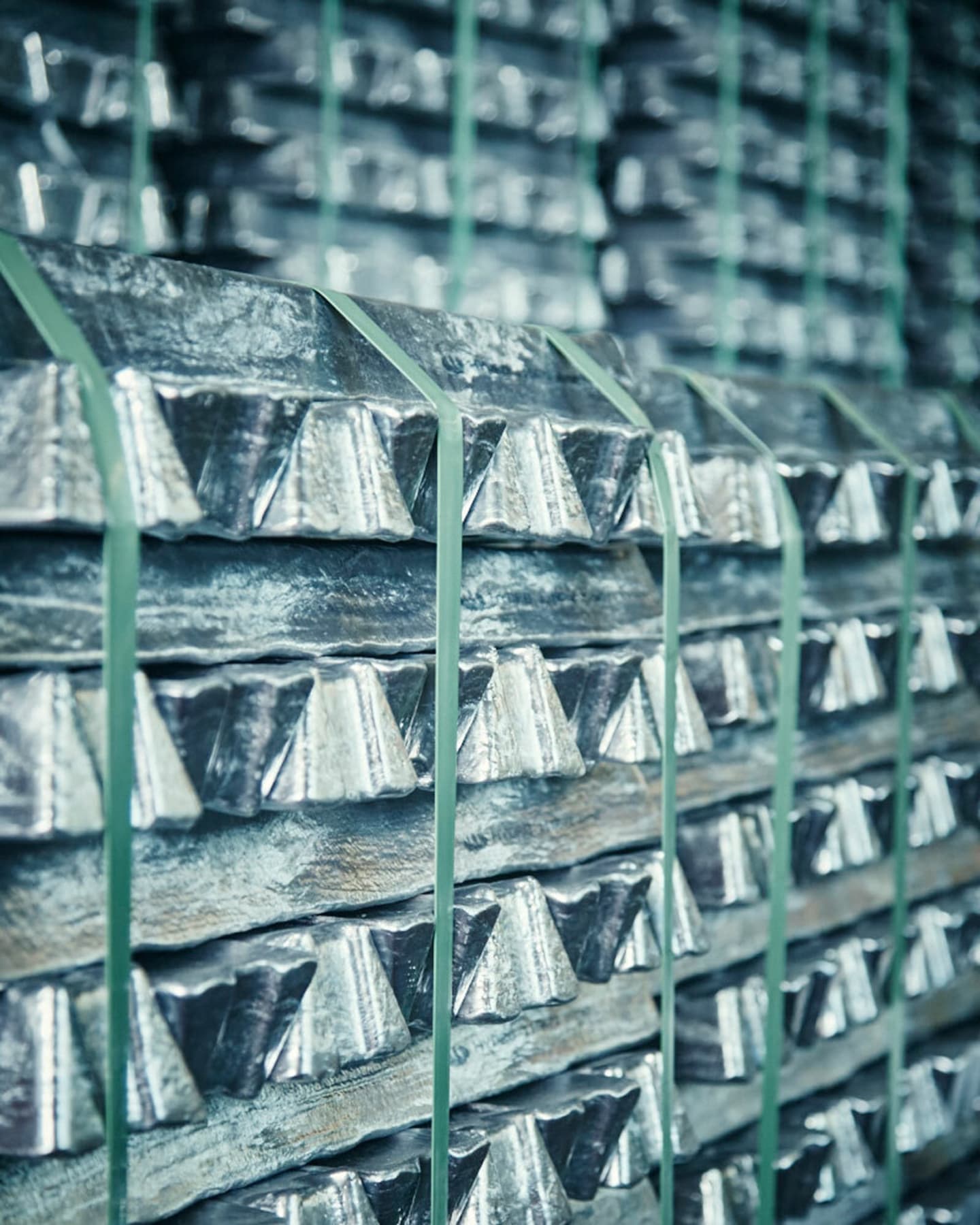 Raw aluminum in the form of stacked metal ingots at the FSB production facility.