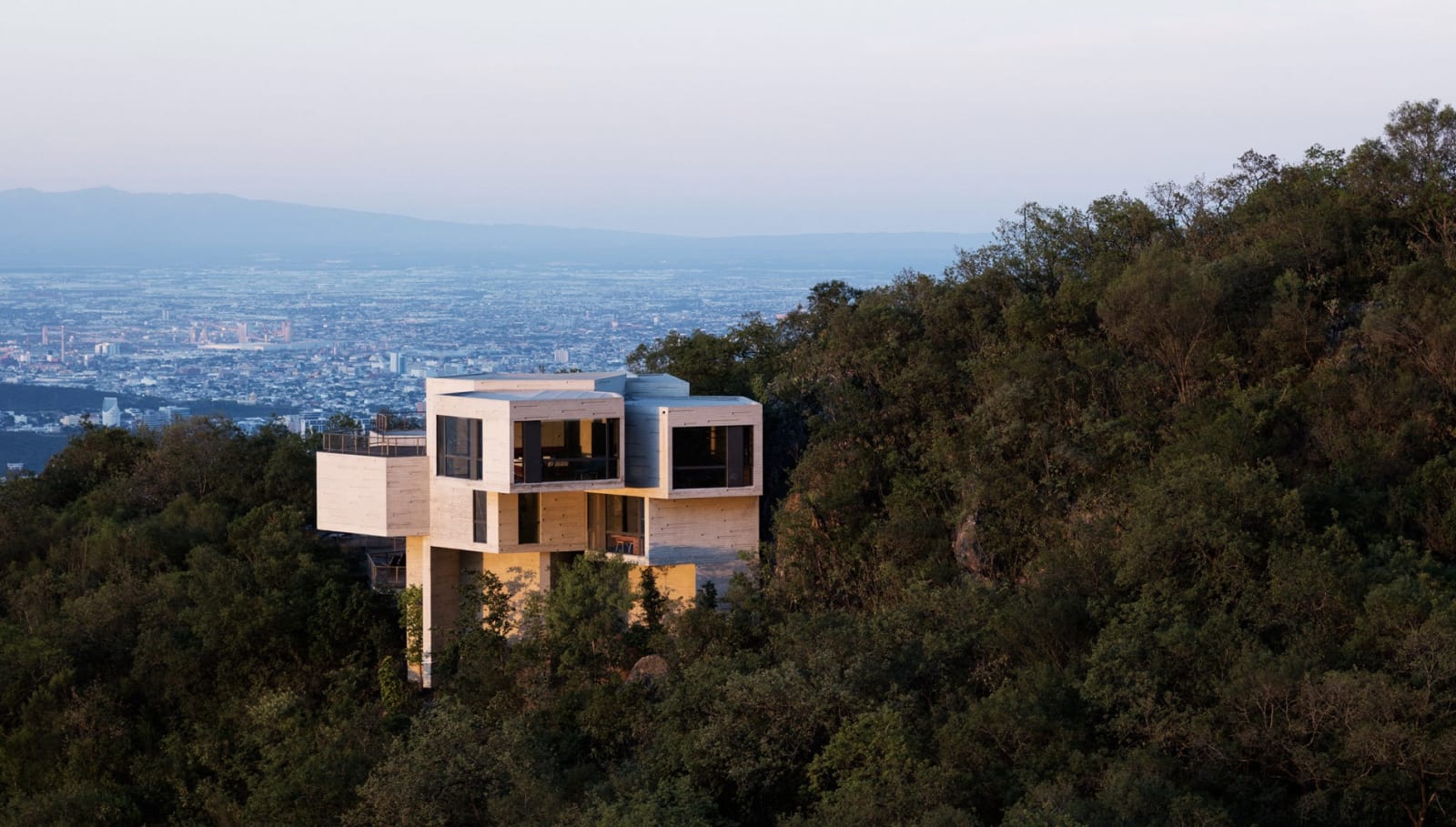 Aerial shot of the Haus Ventura designed by Tatiana Bilbao on the side of a hill in San Pedro Garza Garcia, Nuevo Leon, Mexiko. Built between 2008-2011.