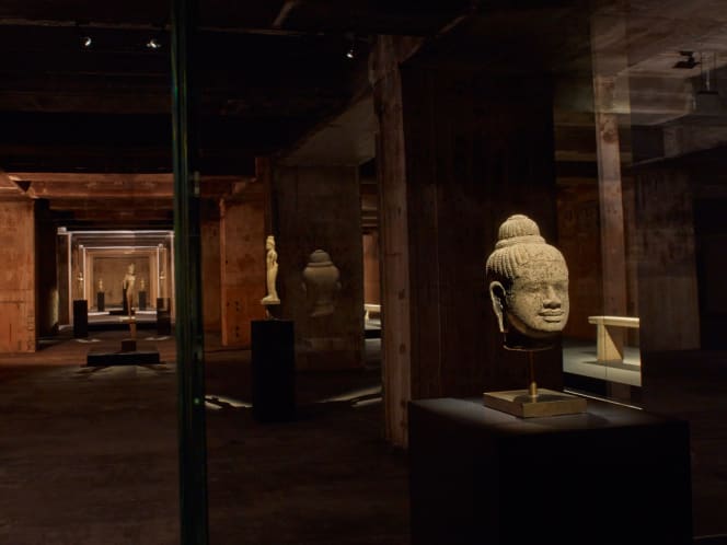 Atmospheric photo of a bust in a vitrine in the Feuerle Collection. Photo by Nic Tenwiggenhorn.