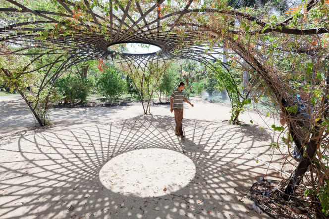 Trellis pavilion with a circular opening at the center, part of the Culiacán Botanical Garden designed by Tatiana Bilbao. Photo by Iwan Baan.