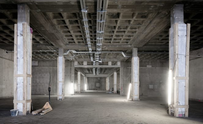 Photo of the stripped exhibition rooms on the lower floor during renovations.