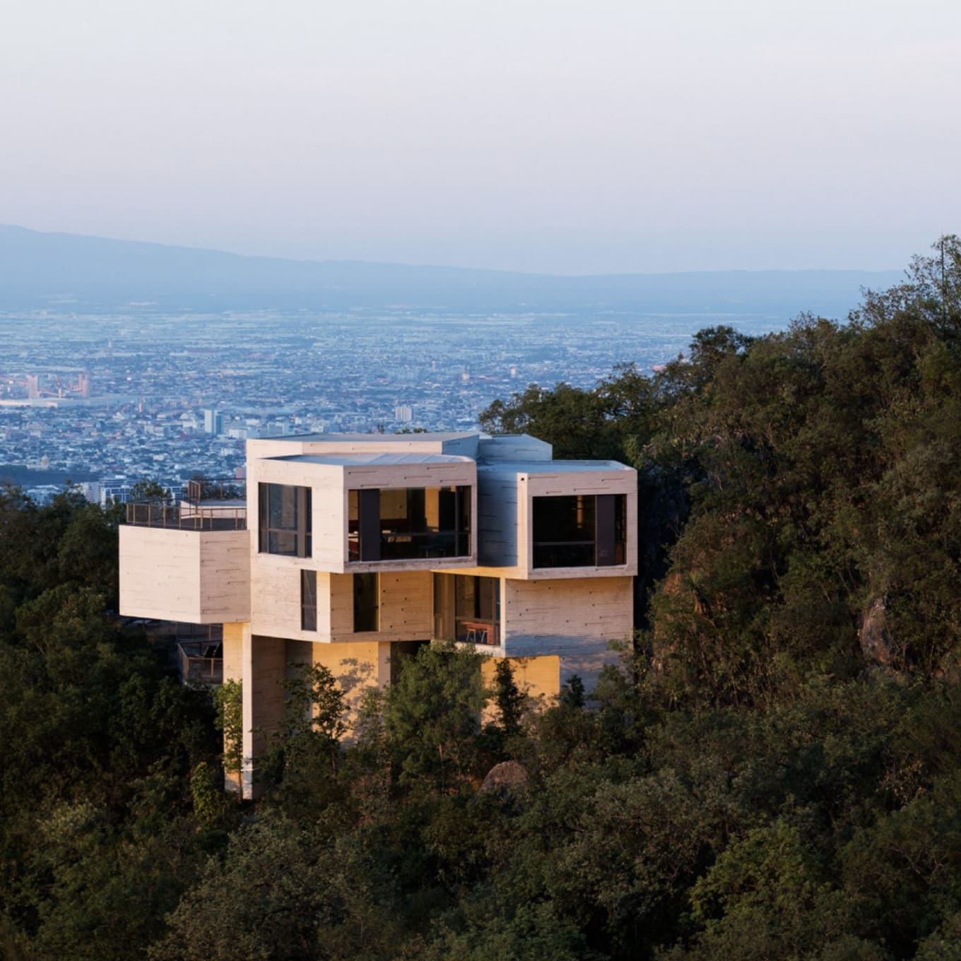 Aerial shot of the Haus Ventura designed by Tatiana Bilbao on the side of a hill in San Pedro Garza Garcia, Nuevo Leon, Mexiko. Built between 2008-2011.