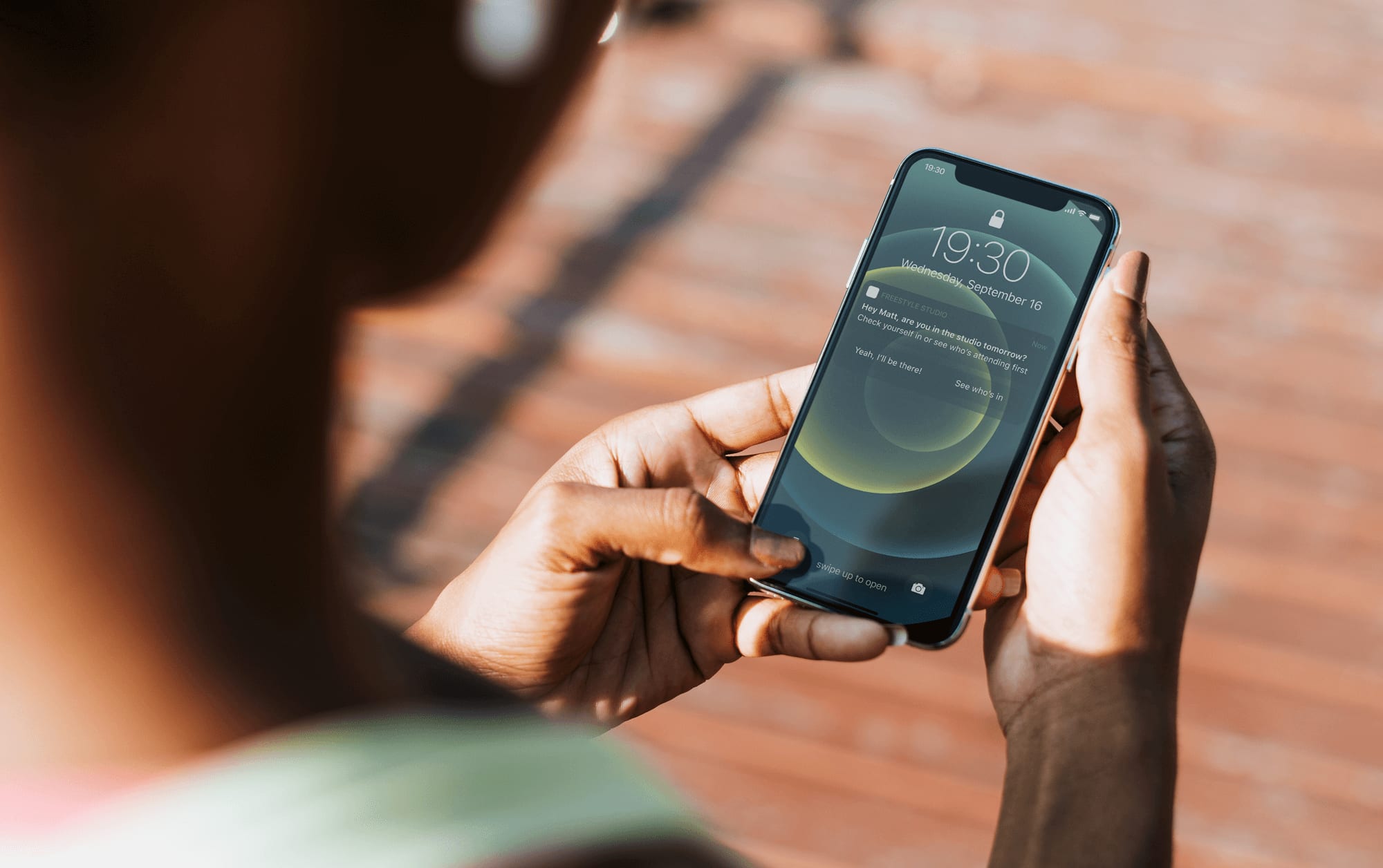 person holding a phone in their hand reading a phone notification