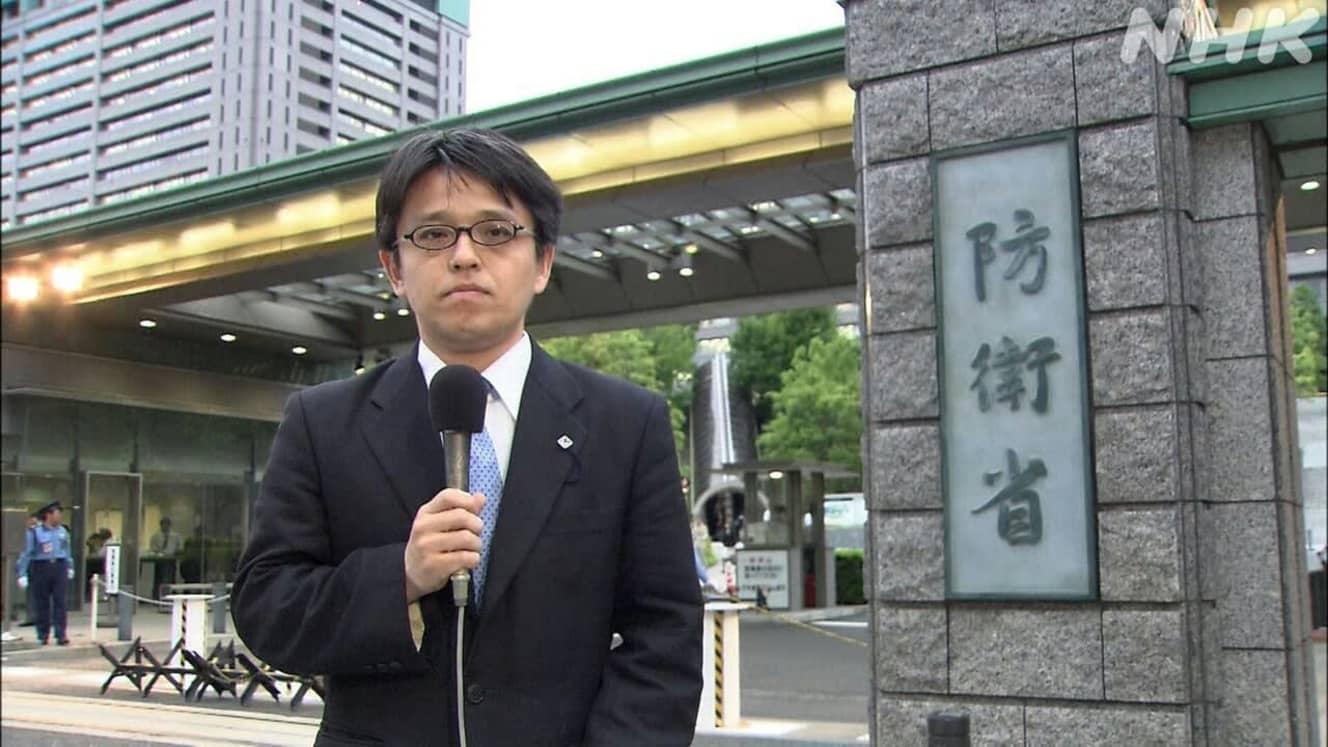 政治部時代の杉田氏。防衛省からリポート(画像:NHK「取材ノート」より)