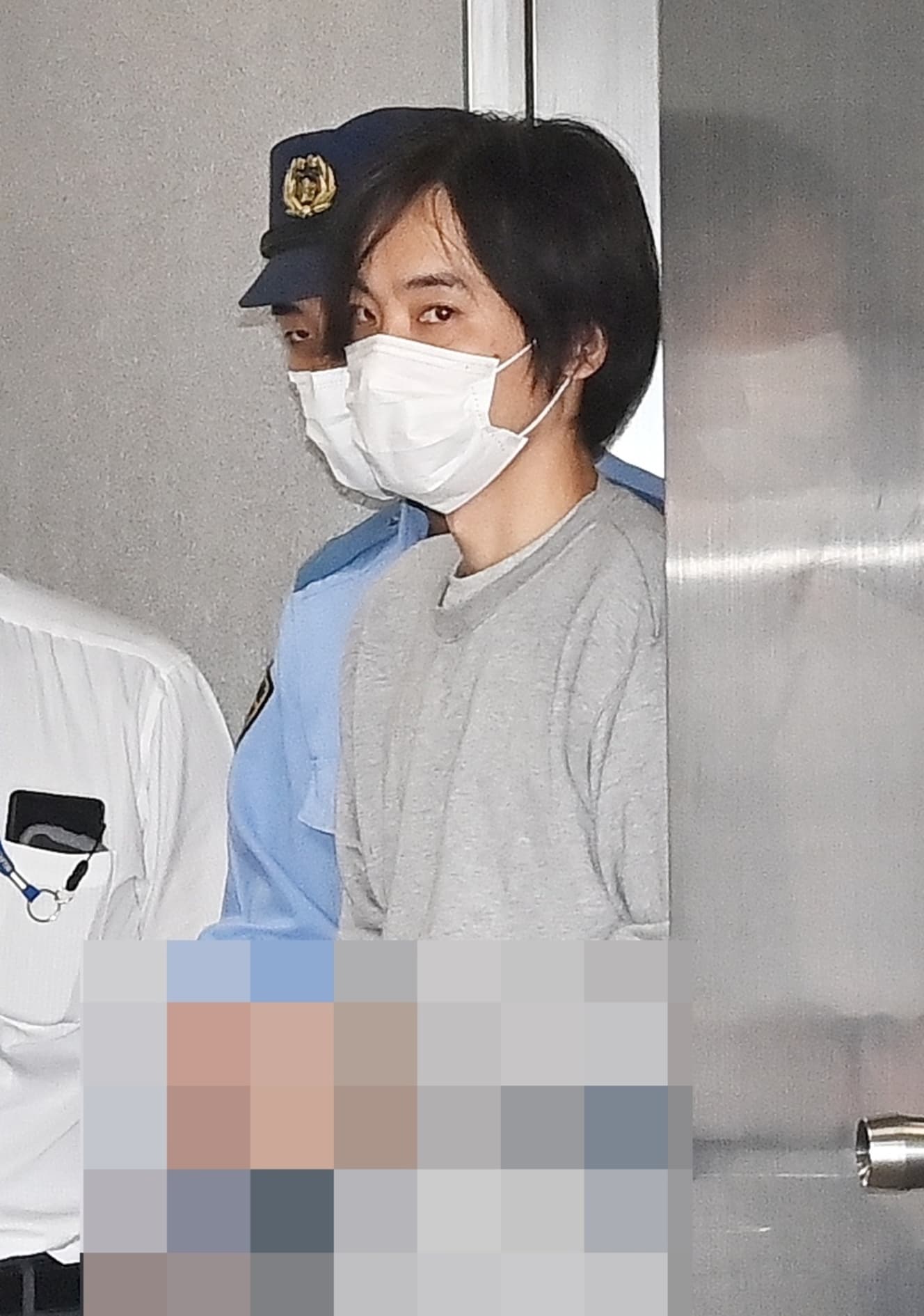 逮捕から数日後に送検された吉田被告（写真は一部加工しています）