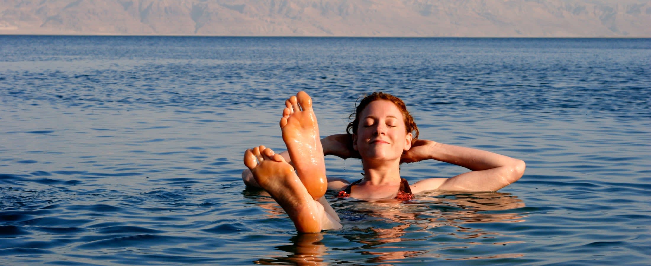 Woman relaxing in the Dead Sea